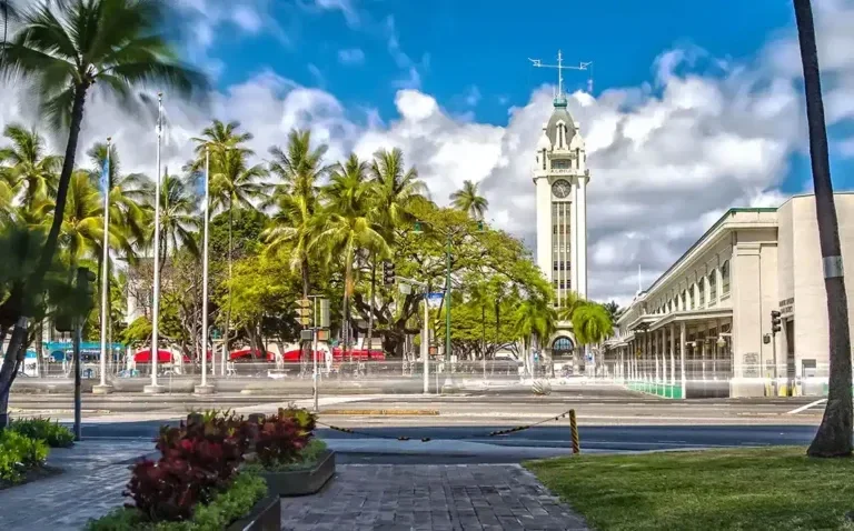 enoatours salute to pearl harbor from ko olina historic clock tower palm trees 